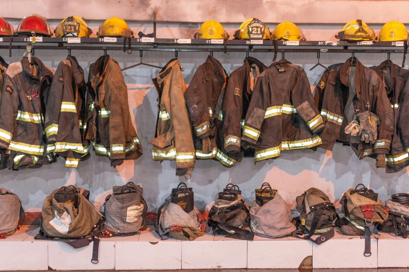 Red fire extinguisher mounted on wall for emergency fire safety